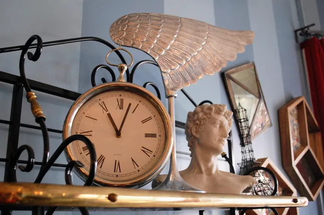Funky decor including clock and bust of Michelangelo's David at Amélie's French Bakery in North Carolina