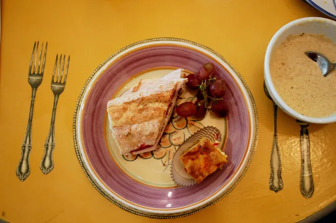 Sandwich, fruit, and small cake at Amélie's French Bakery in North Carolina